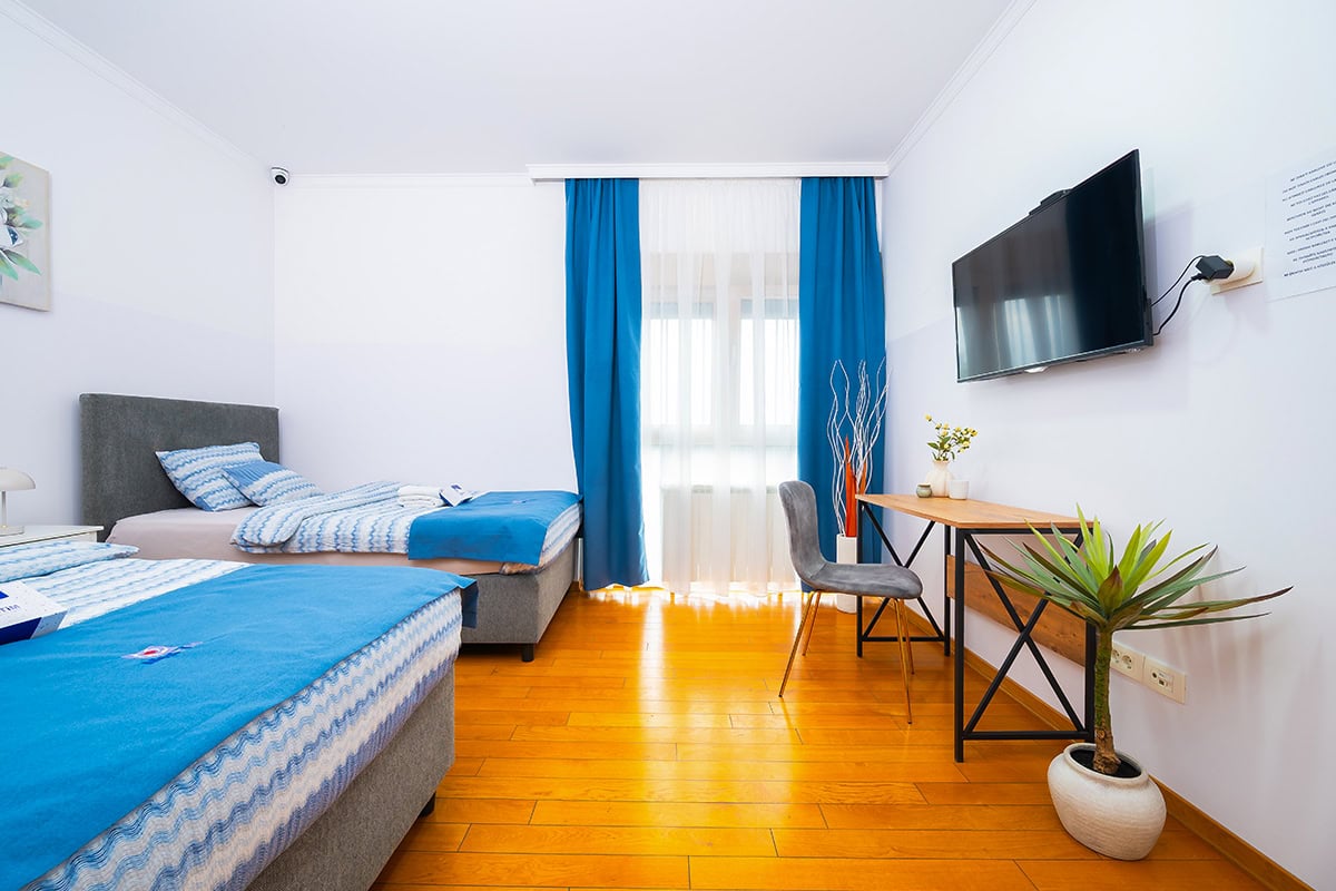Comfortable double room for patient accommodation at MedTiM Clinic