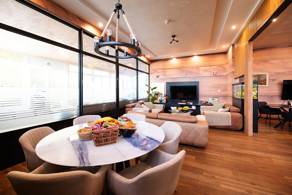 Comfortable patient lounge with armchairs and sofas at MedTiM Clinic